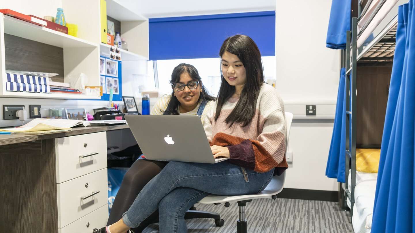 students-looking-at-laptop-in-two-bunk-accommodation-room-36130_header.jpg