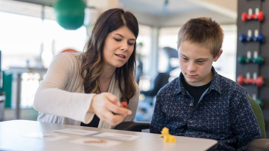 Speech therapist with young person 