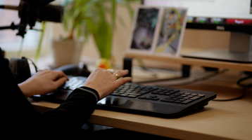 Someone types on a computer keyboard.