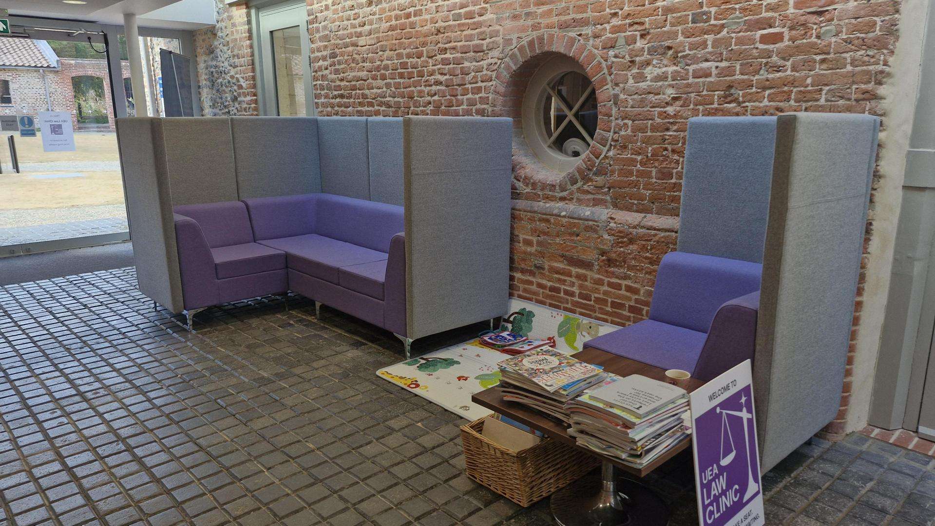 law clinic reception with grey and purple couch