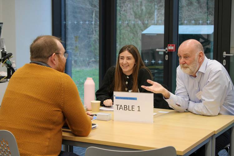 Two professionals interviewing an engineering student at Select 2024.