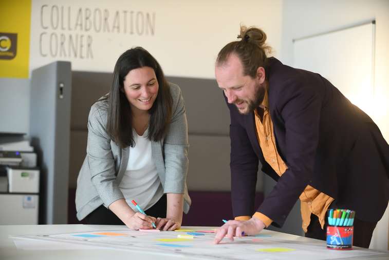 Students walking outside of NBS