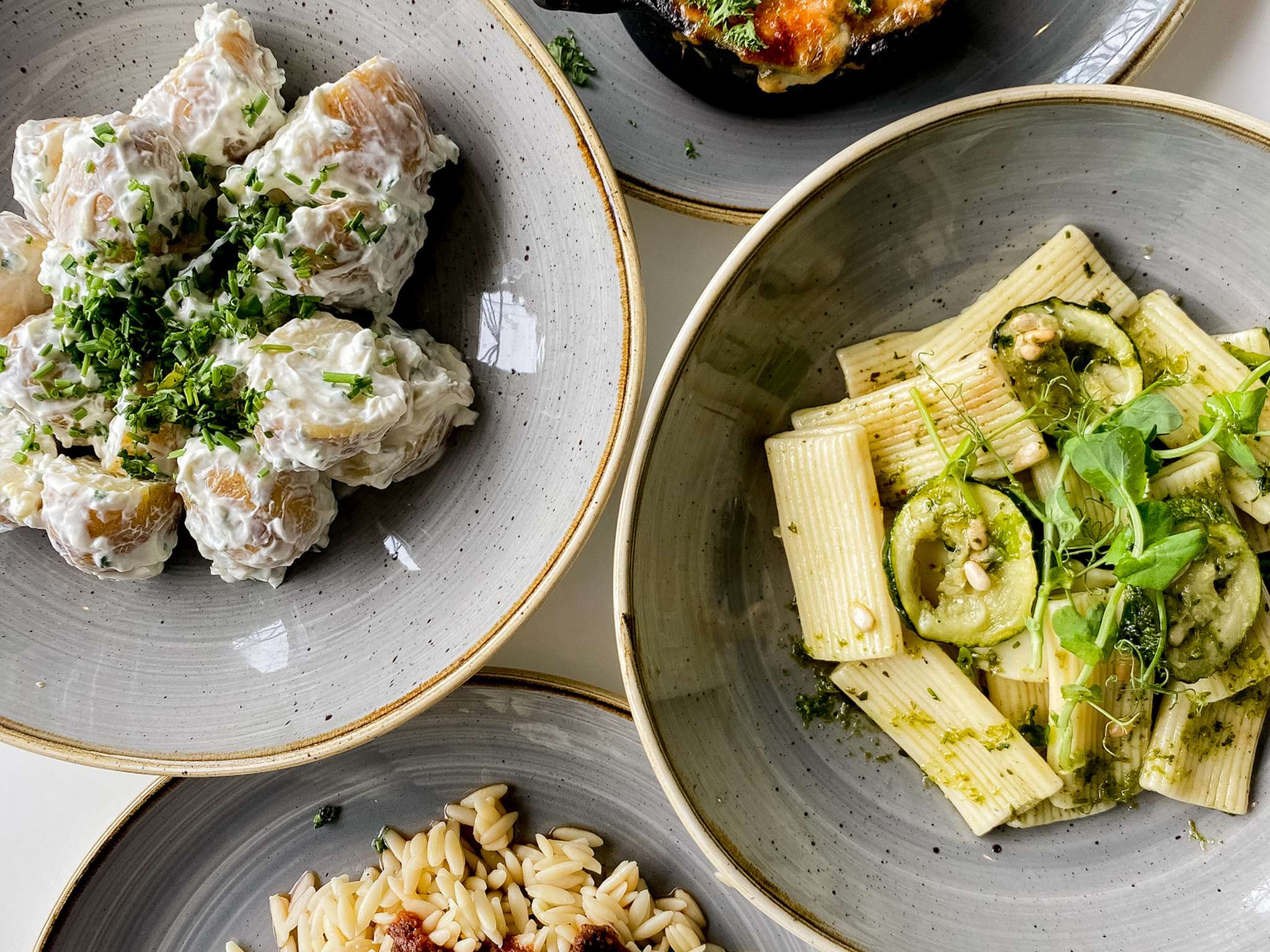 Four plates of food from the Modern Life Cafe.