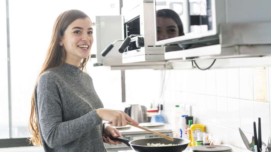 Student cooking in accommodation