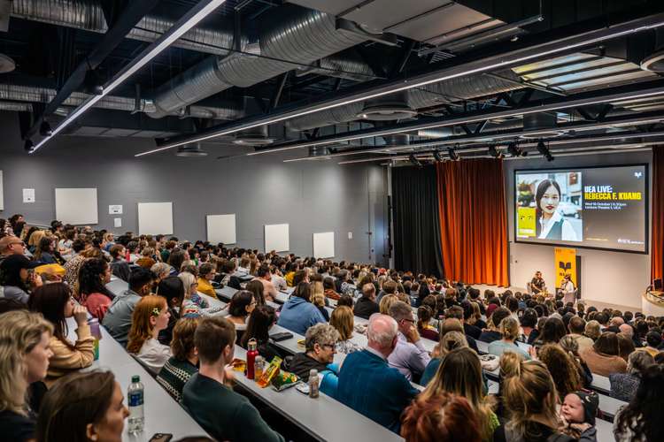 A full lecture theatre of people in LT1.