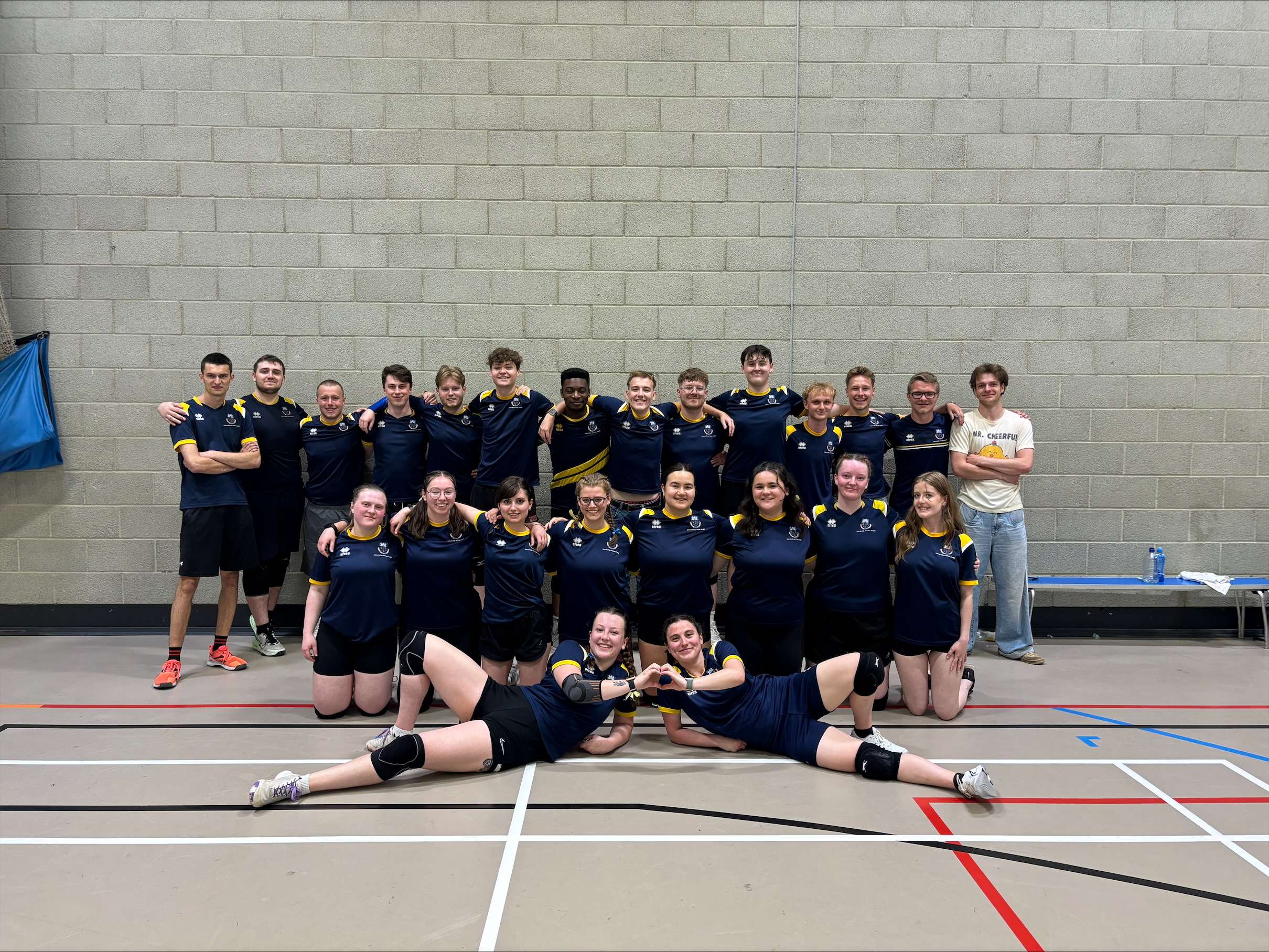 UEA Dodgeball team facing the camera and smiling for a team photo.