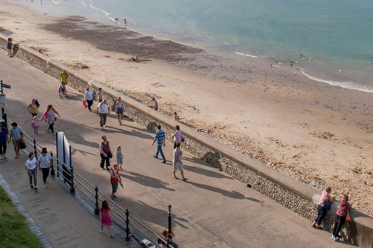 A beach with a blue sky and sea