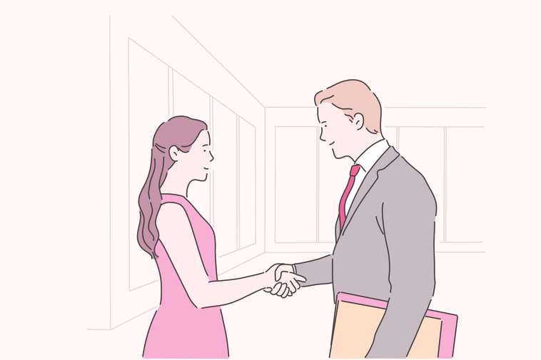 woman shaking hands with a man