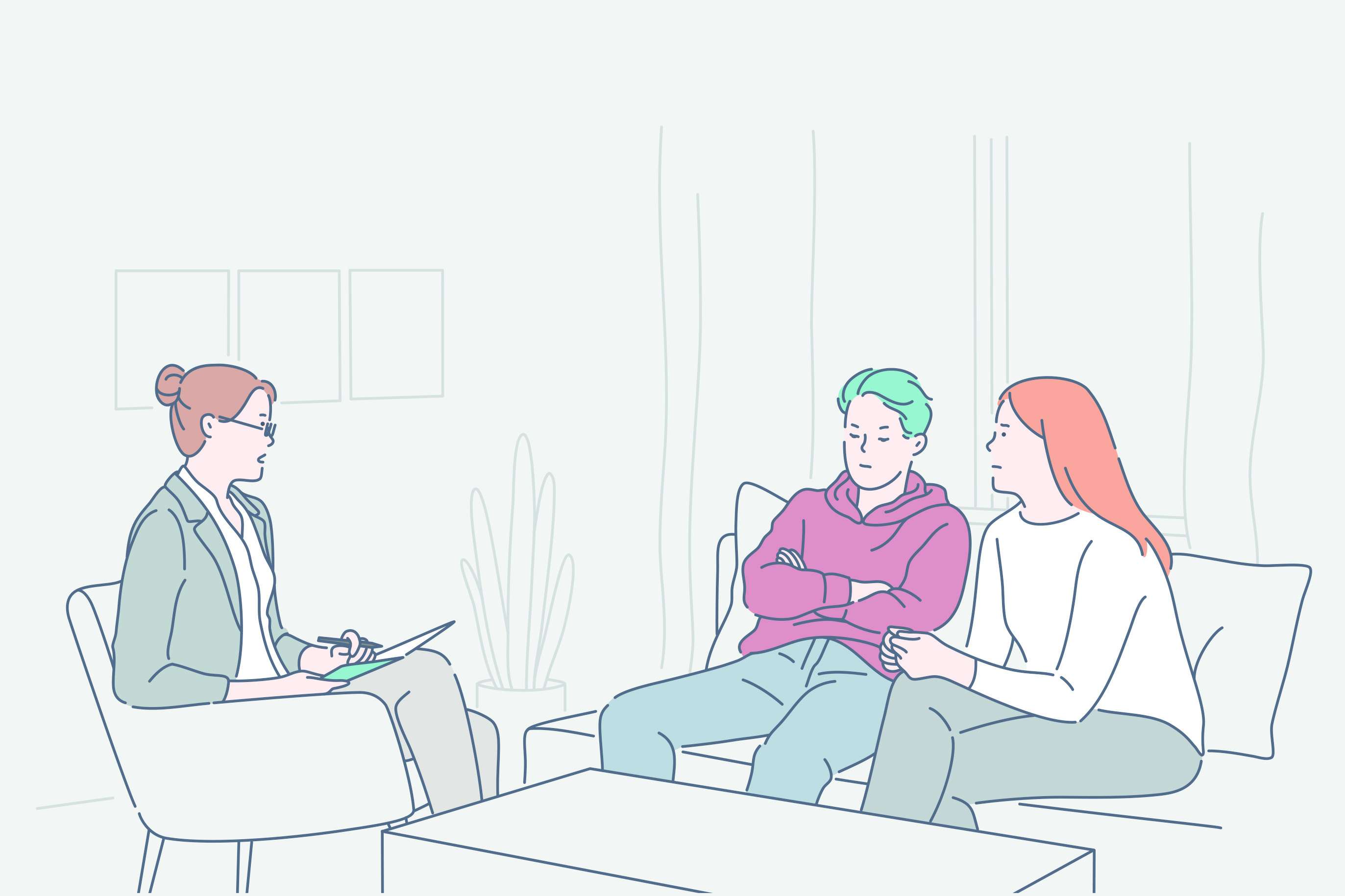 Three people sitting around the table, getting advice