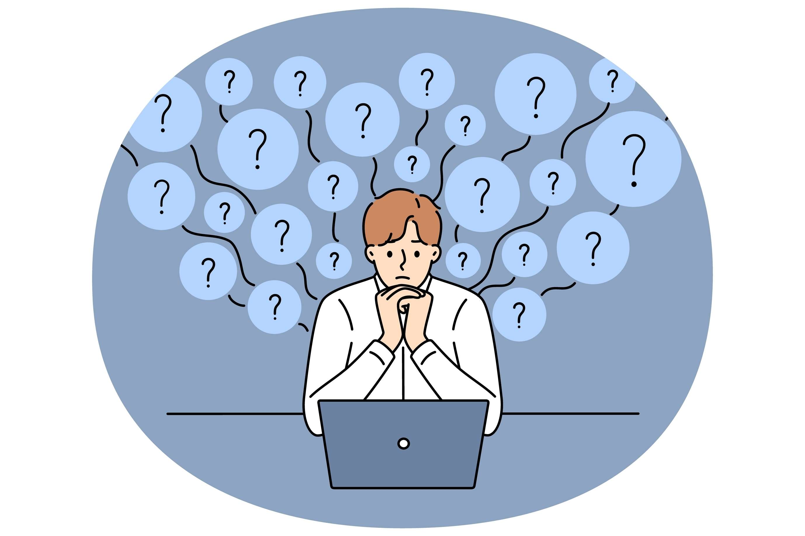 man sitting at computer with question marks in the air