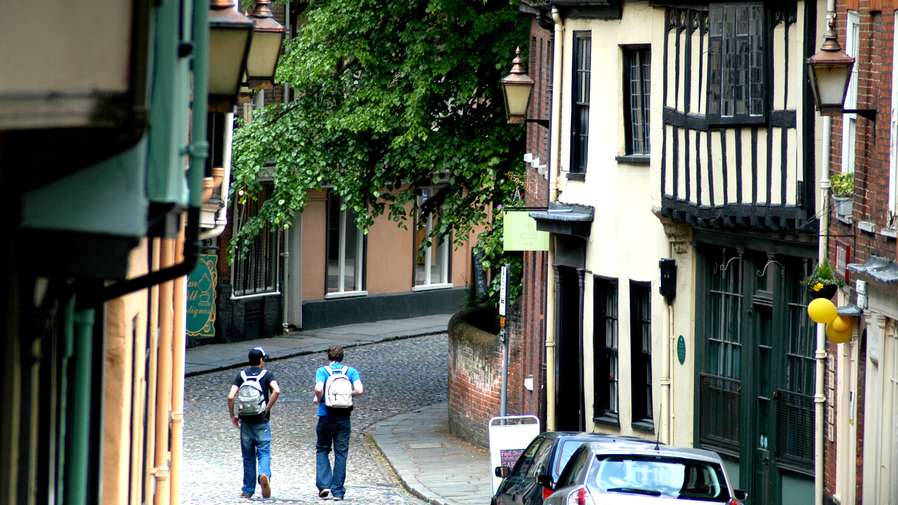 People walking in Elm Hill - Norwich City Centre