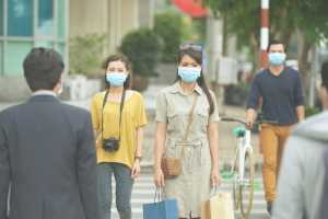 Asian-people-in-street-wearing-protective-face-masks_small