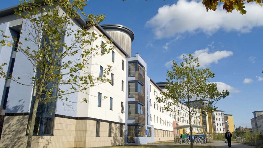 Student walking outside Paston House