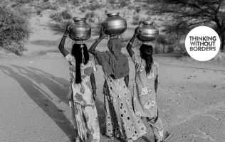 women carrying pots