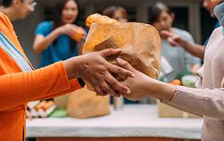 Picture of someone receiving food at a foodbank