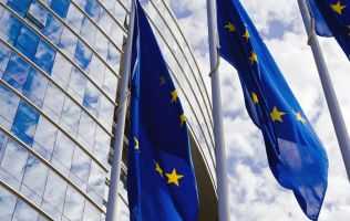 Image of EU flag flying outside building