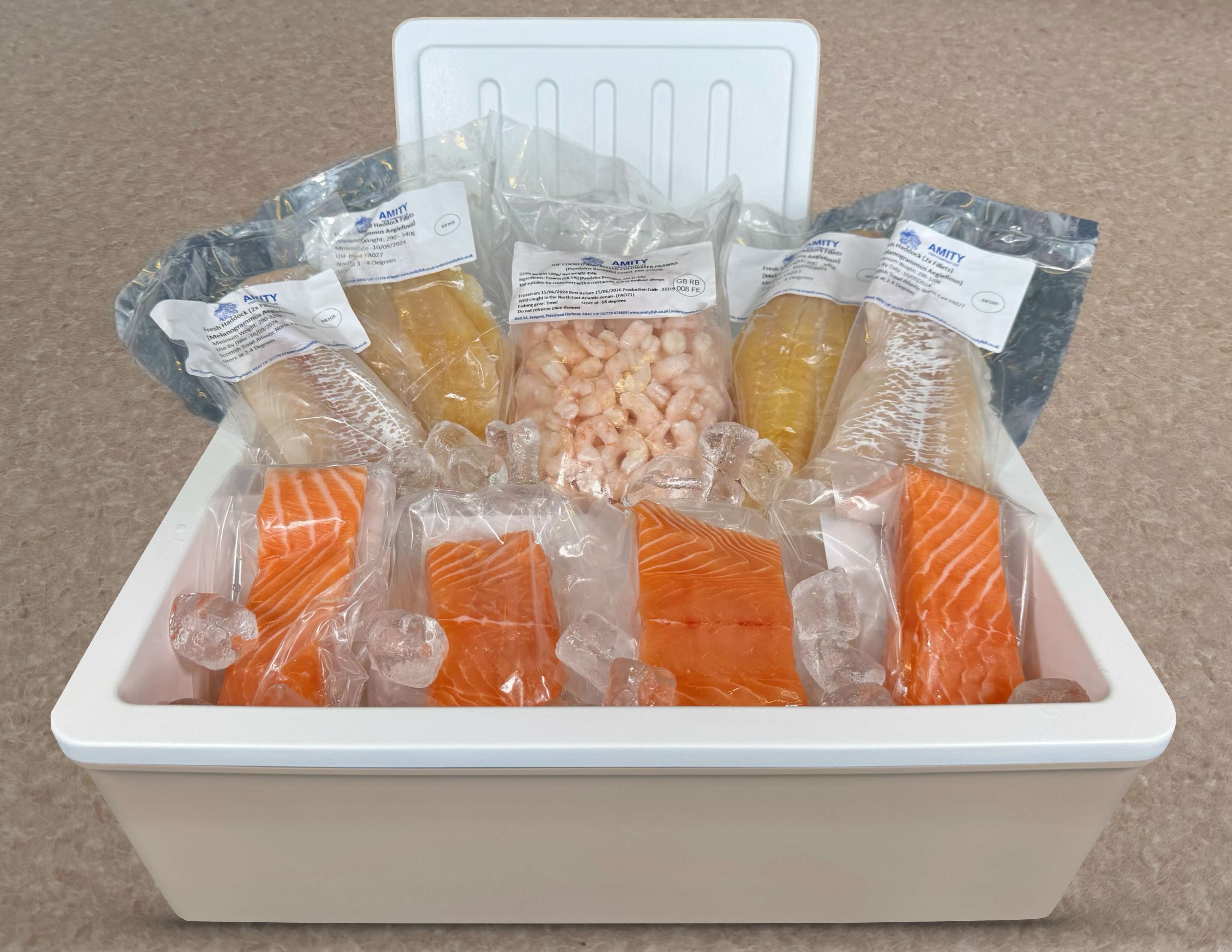 Image with insulated produce box containing fish and prawns