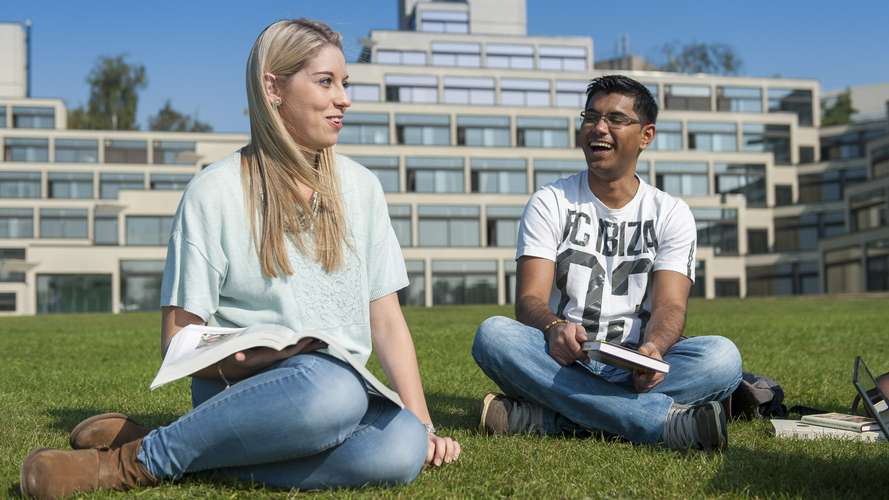 Students sitting on grass