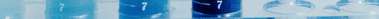 Image of blue liquids in three measuring vials