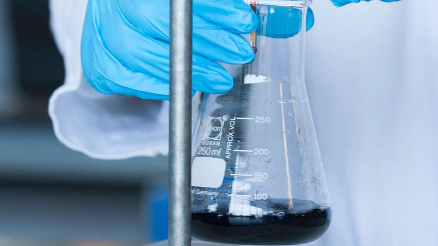 Conical Flask being used by a student in the Science labs