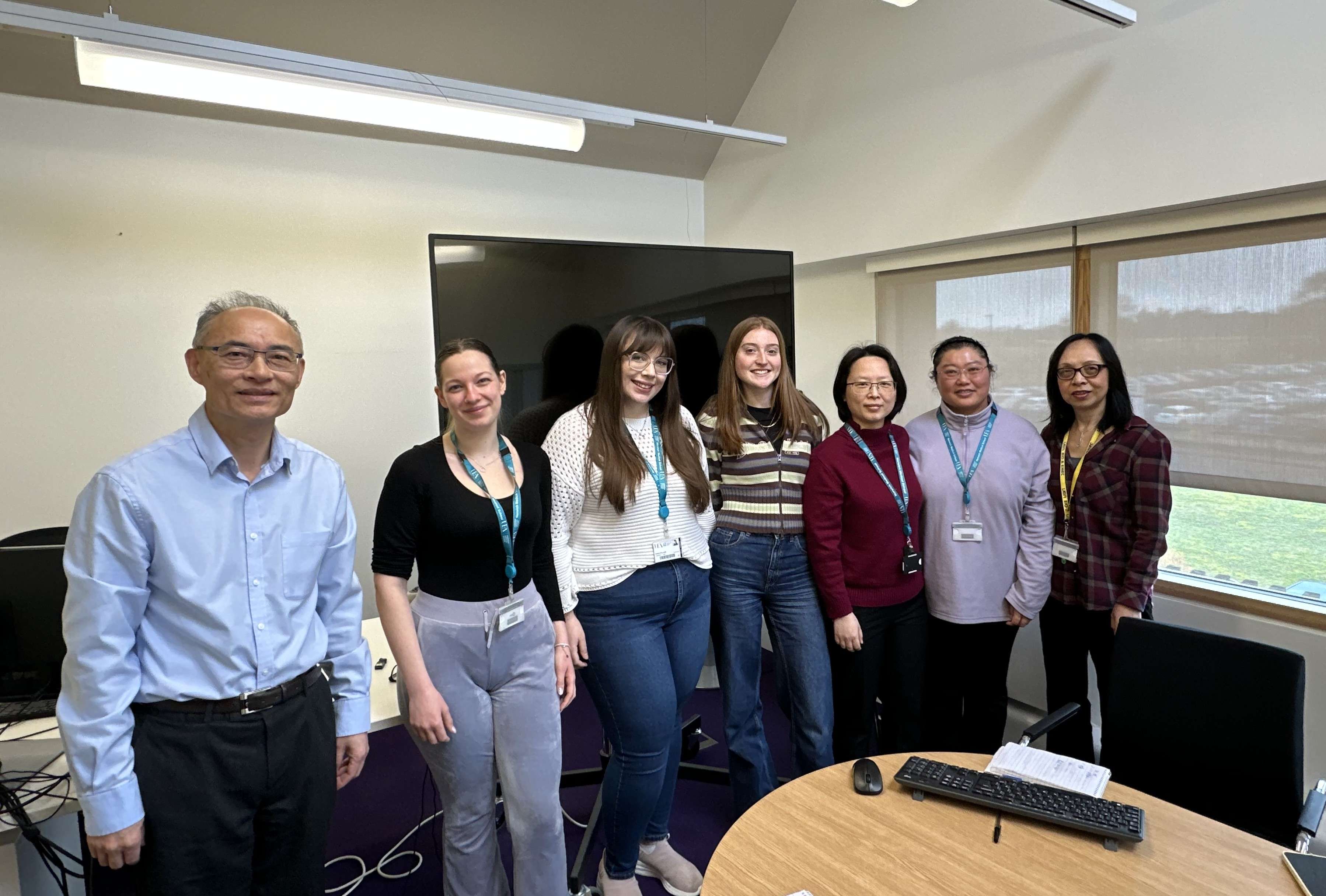 Group of people stood in an office