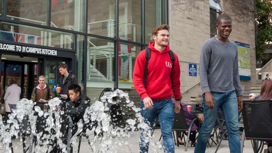 Students walking through the Square