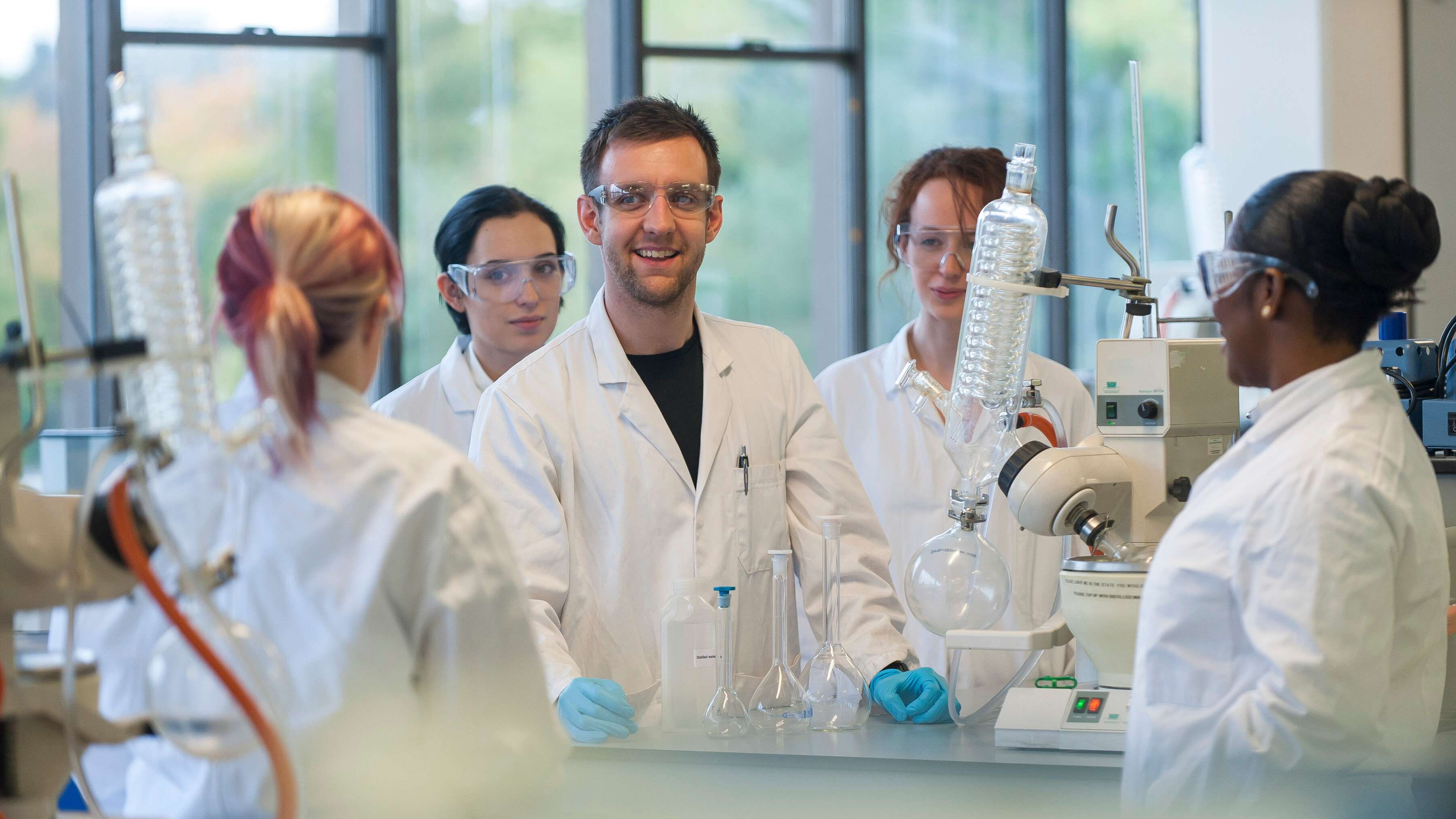 Mature Chemist student in a practical session on campus