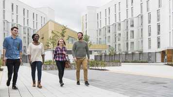 People walking outside UEA accommodation