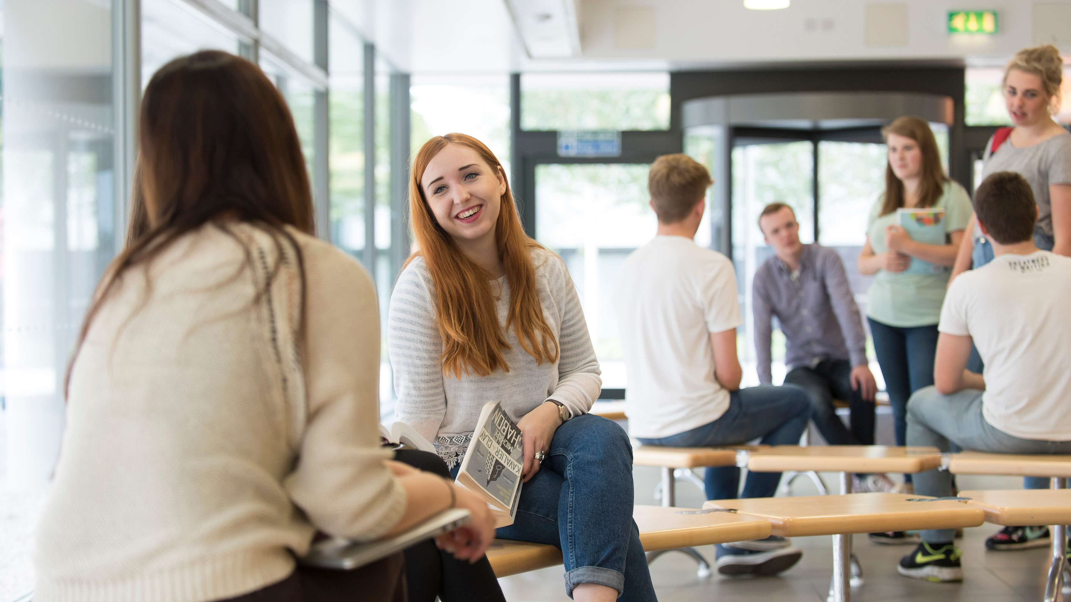 Students talking in the reception of the Thomas Paine Study Centre on Campus
