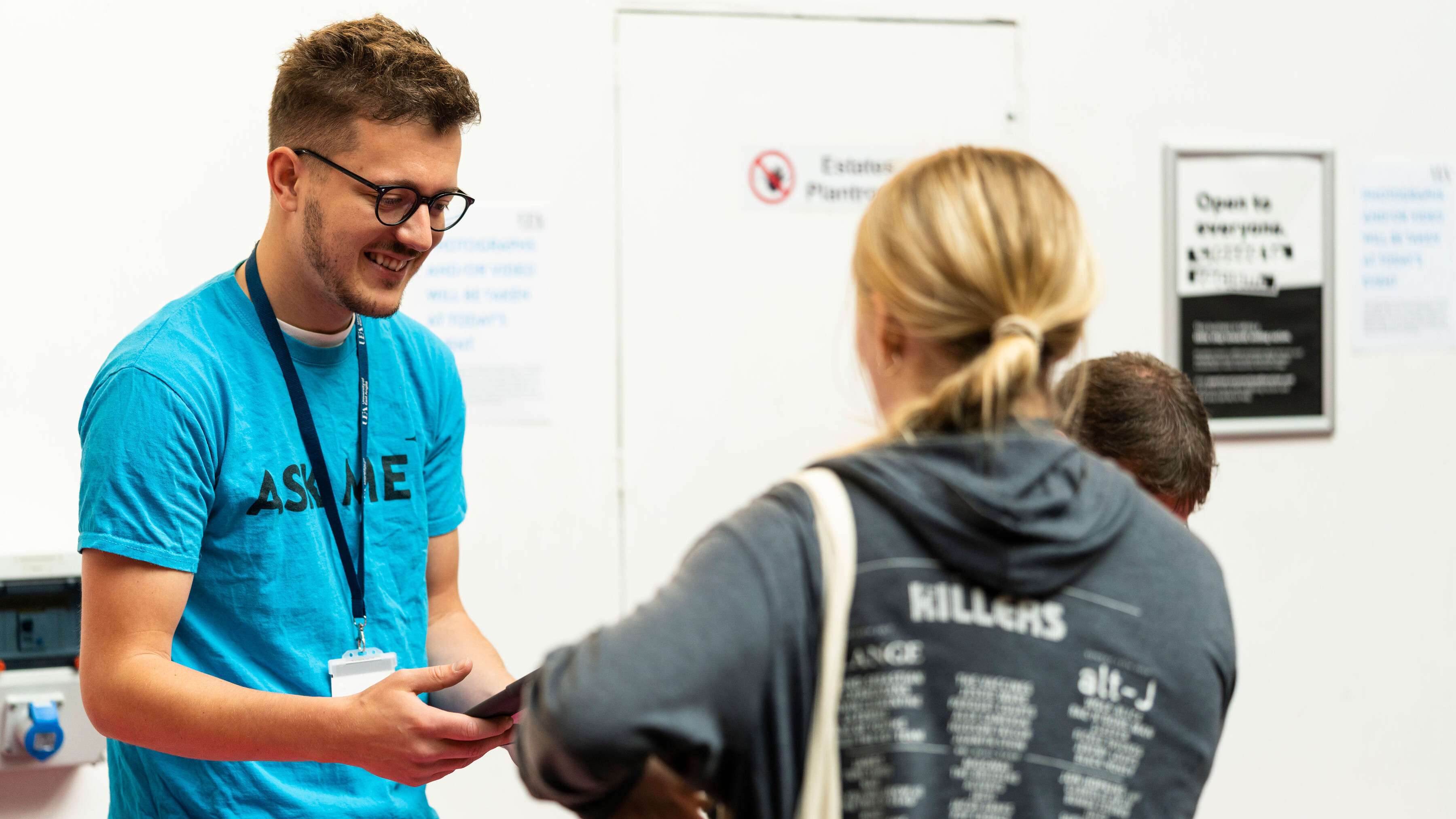 student ambassador checking in visitors