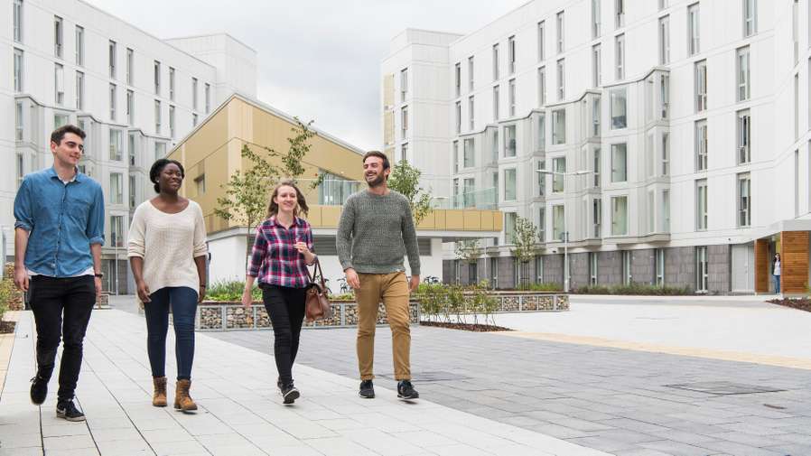 Students walking outside UEA Accommodation - Barton and Hickling Houses