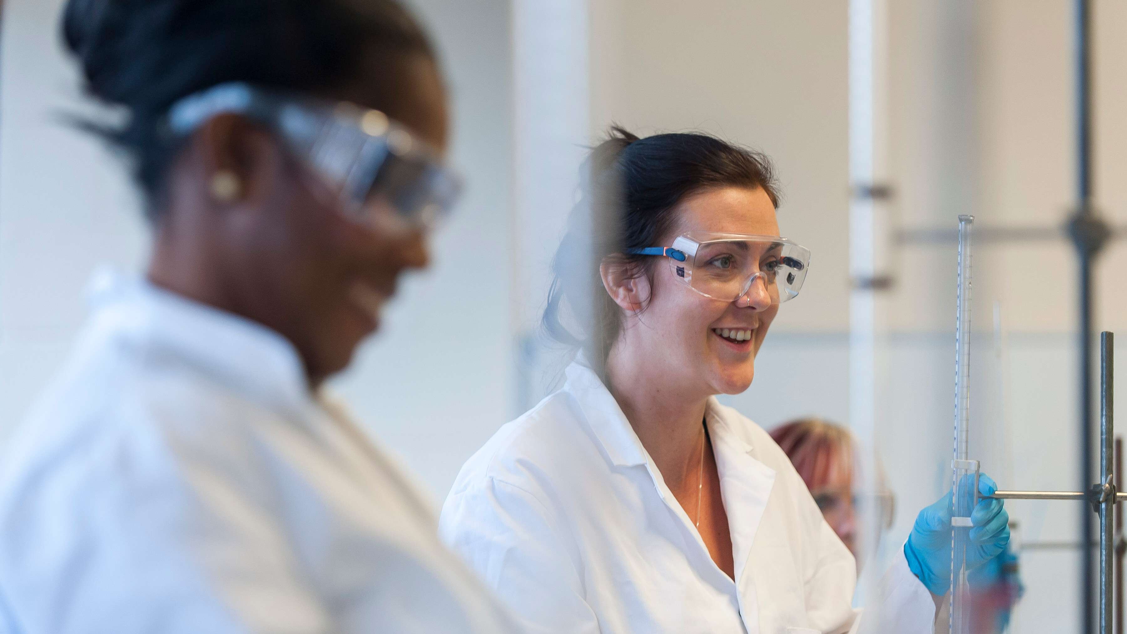 Mature Chemist student in a practical session on campus