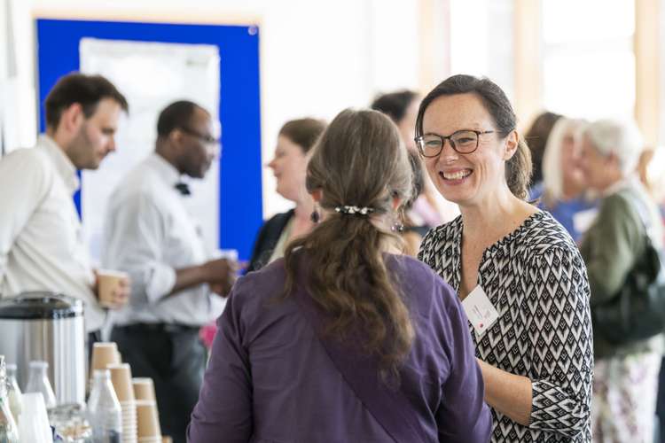 People speaking to each other at an event