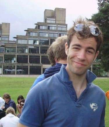 Photo of Ed Goodall cheekily smirking during his tenure at UEA