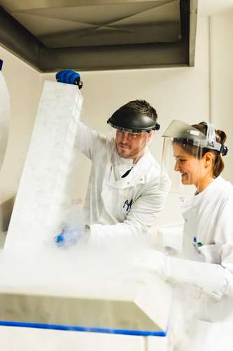 Dr Darrell Green with a team member in a laboratory.