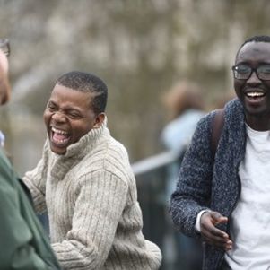 3 students laughing