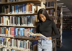 12. Student browsing bookshelves in the Library _13_George Ward_51227.jpg