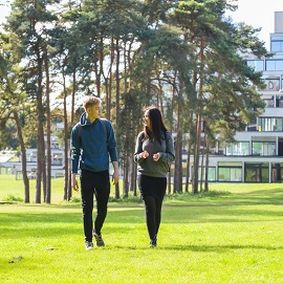 Students walking near ziggurats