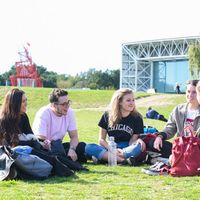 Students sitting on grass