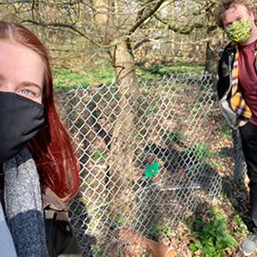 people stood next to 'hedgehog highway'