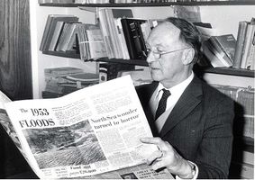 Hubert Lamb reading newspaper