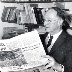 Hubert Lamb reading newspaper