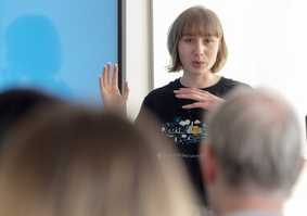 A staff member teaching in a lecture
