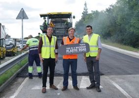 MacRebur employees holding a sign
