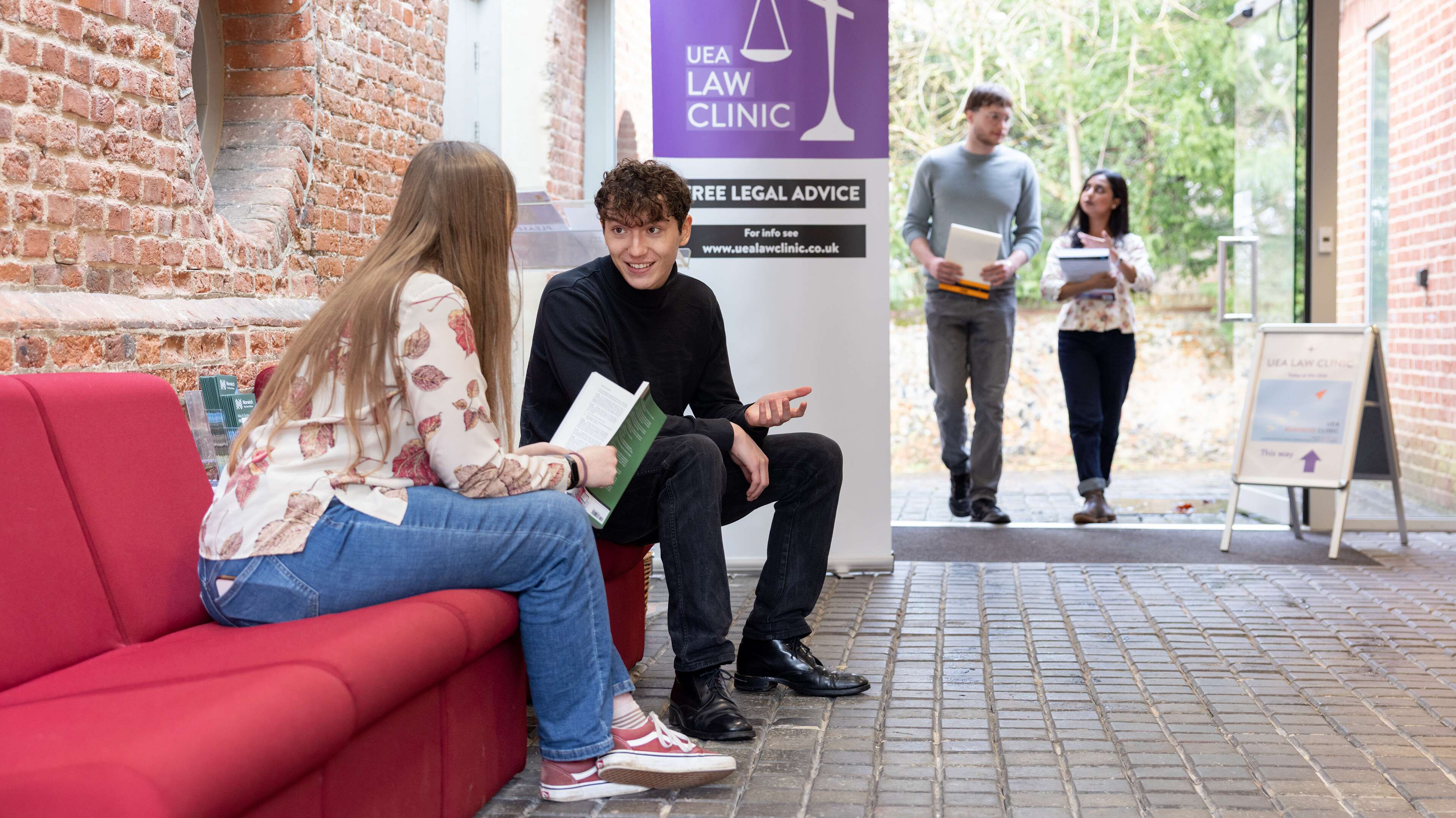 Law students working together in a law clinic session at Earlham Hall