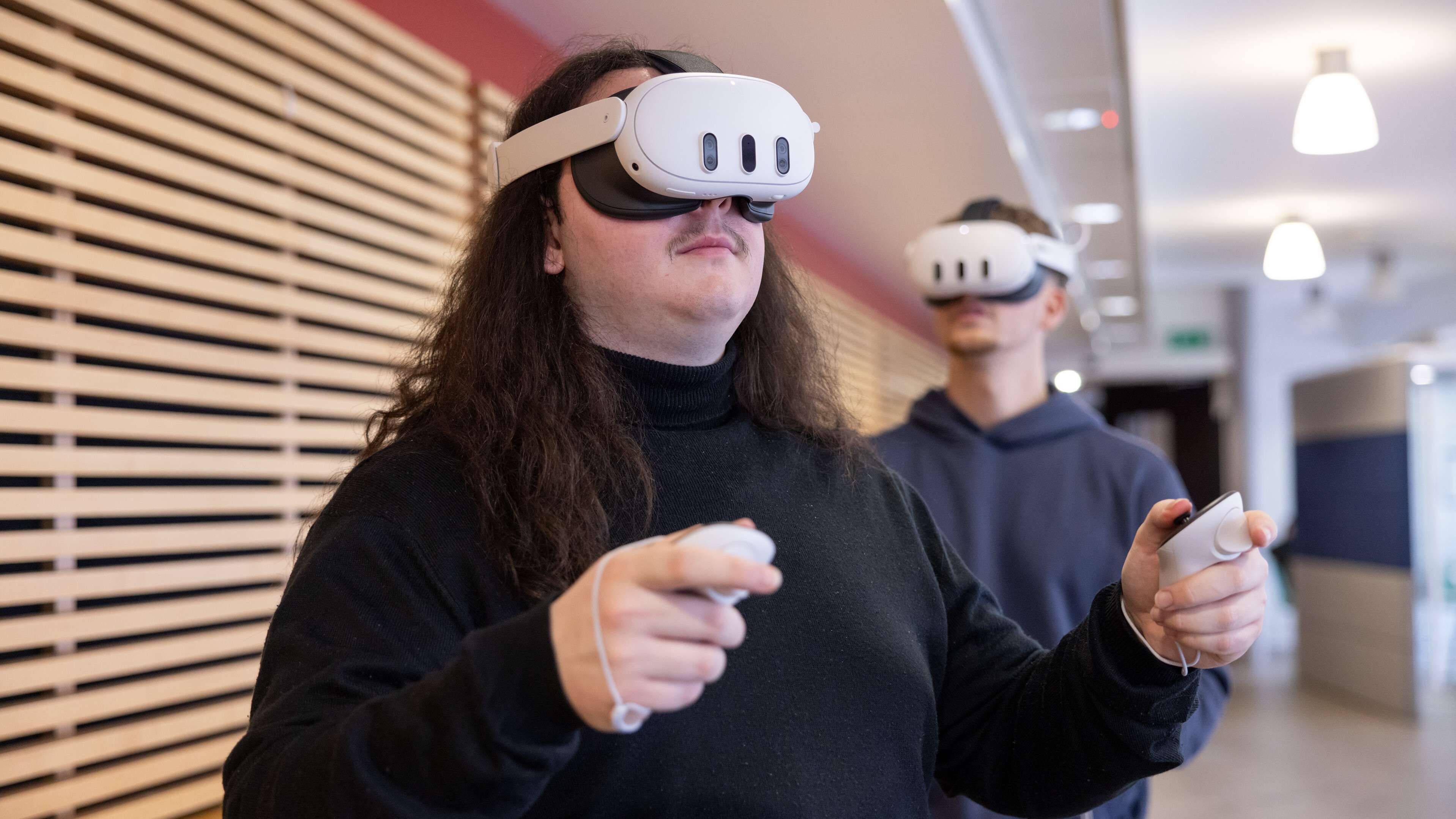 Business Students are working with VR Headset in the Thomas Paine Study Center
