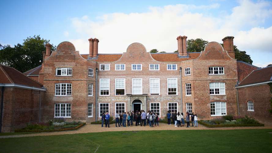 Students outside Earlham Hall home to the Law School at UEA