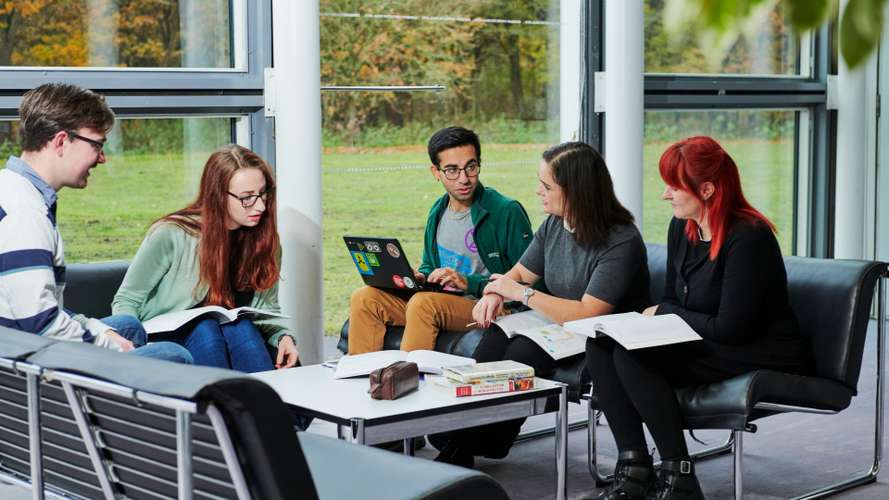 Mature students collaborating in Sainsbury Centre.