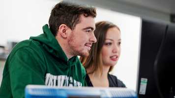 Mature students working in Electrical Engineering laboratory in New Science Building.