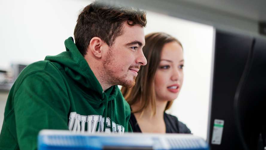 Mature students working in Electrical Engineering laboratory in New Science Building.